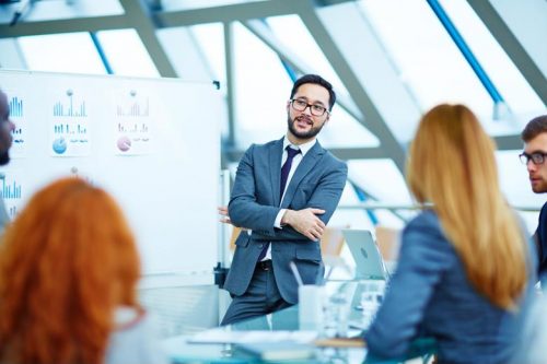 An MBA degree holder leads a work presentation