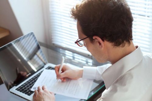 Businessperson at a computer.