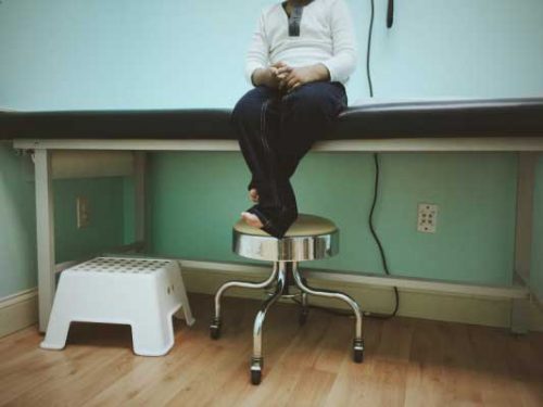 Young child waits for FNP in medical clinic