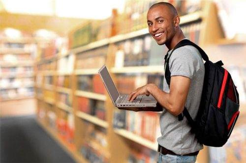 Student holding laptop