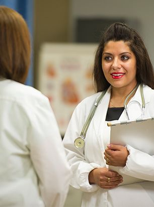 Female doctor holding clipboard