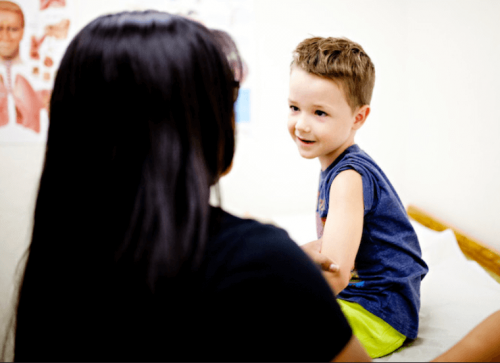 child on examination table
