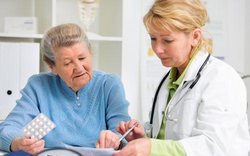 Nurse Practitioner with older woman patient
