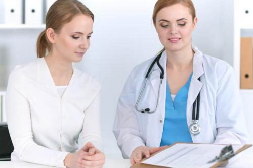 Nurse practitioner discussing care plan with a patient.