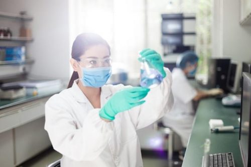 A nurse researcher works in a laboratory.