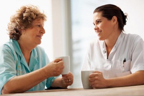 Two healthcare professionals having a conversation