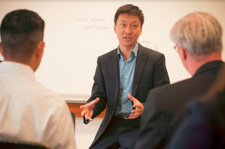 Northeastern University’s Jackson Slomiak discusses concepts with colleagues.