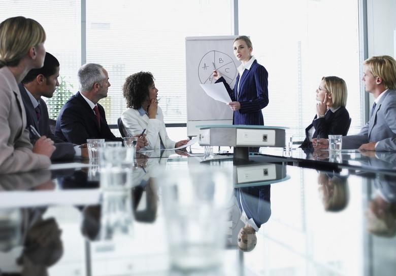 A CFO delivers a presentation to other executives