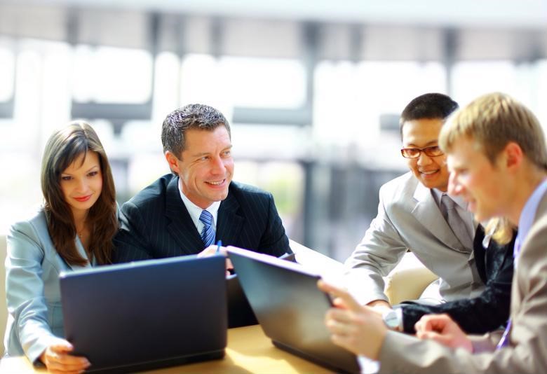 A CFO discusses financial strategy with a small team