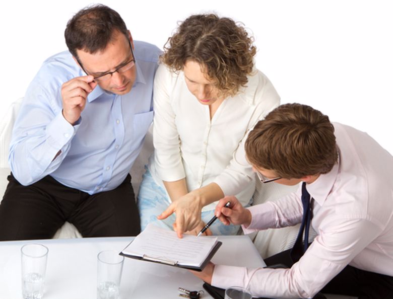 A tax accountant shows a financial document.