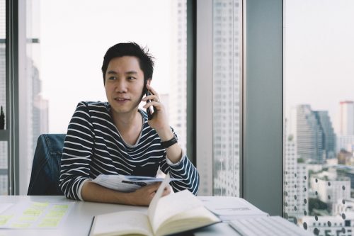 A PR professional communicating with a colleague about a digital campaign.