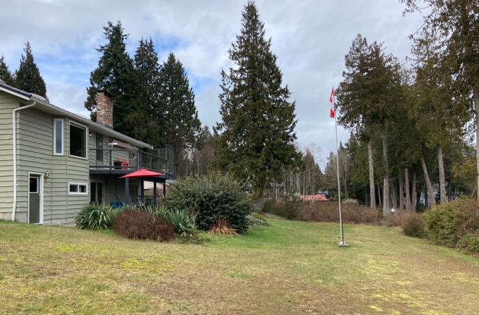 Expansive Yard with Beach Access