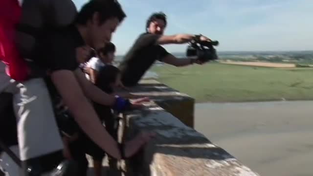 Robot friend helps paralysed man climb Mont Saint-