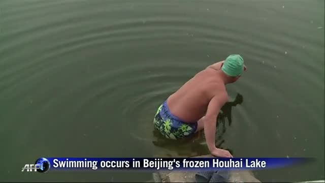 Chinese ice swimmers plunge into freezing waters