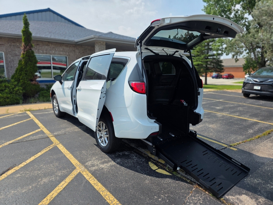 White Chrysler Voyager with Rear Entry Manual Fold Out ramp