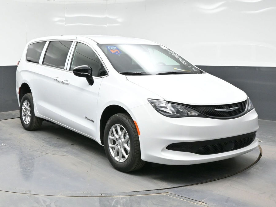 White Chrysler Voyager with Rear Entry Manual Fold Out ramp