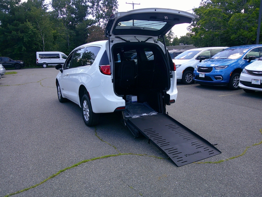 White Chrysler Voyager with Rear Entry Manual Fold Out ramp