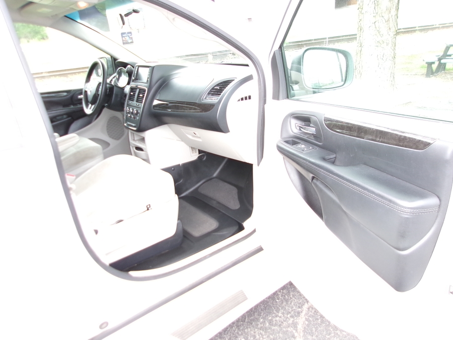 White Dodge Grand Caravan with Side Entry Manual Fold Out ramp
