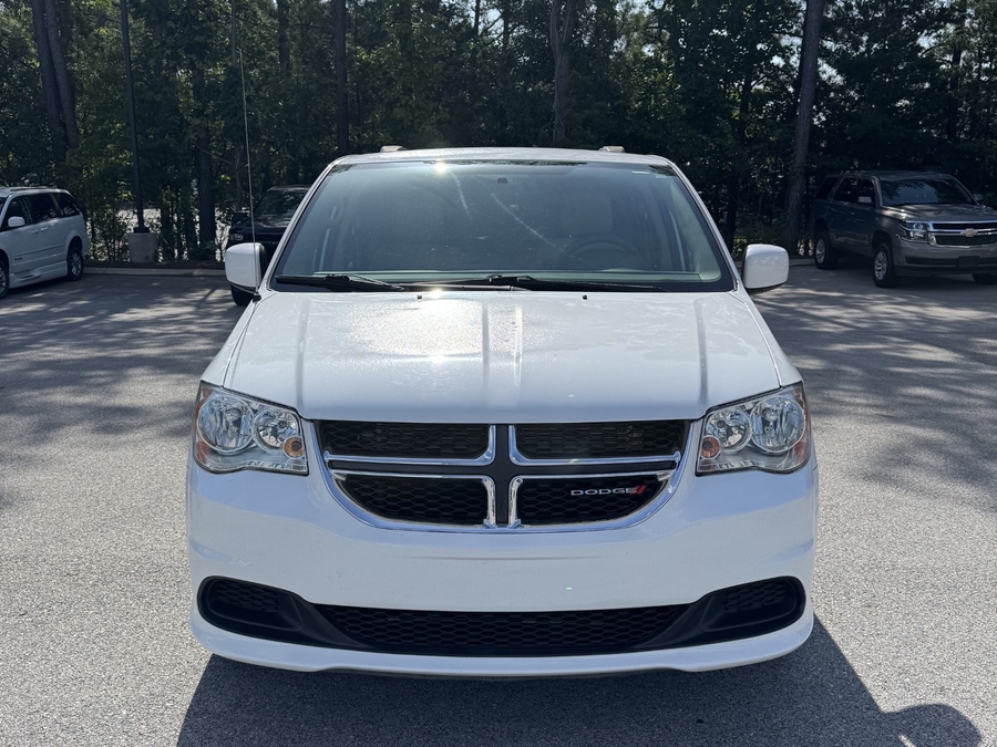 White Dodge Grand Caravan with Side Entry Manual Fold Out ramp