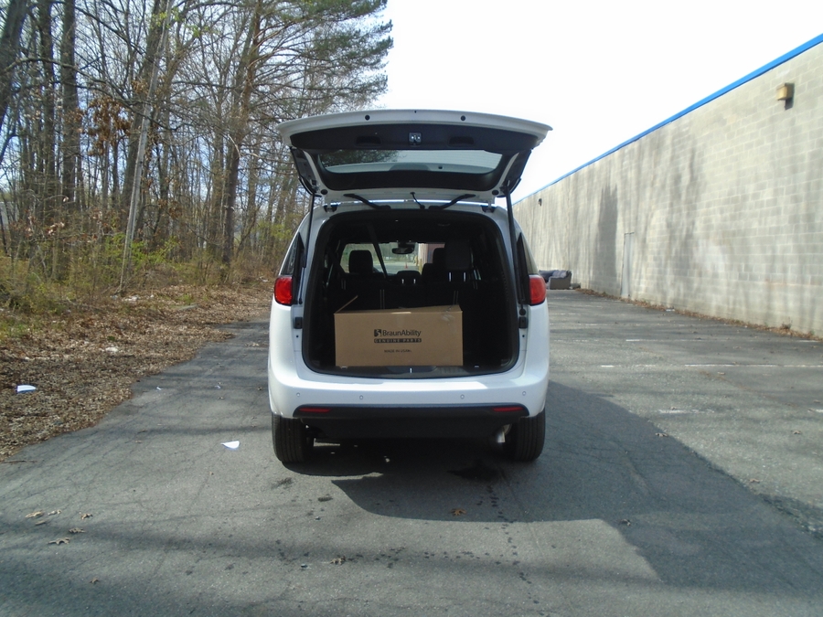 White Chrysler Voyager with Side Entry Manual Fold Out ramp