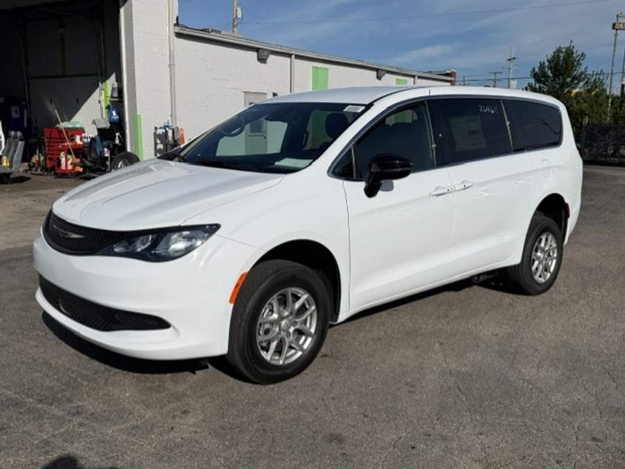 White Chrysler Voyager with Rear Entry Manual Fold Out ramp