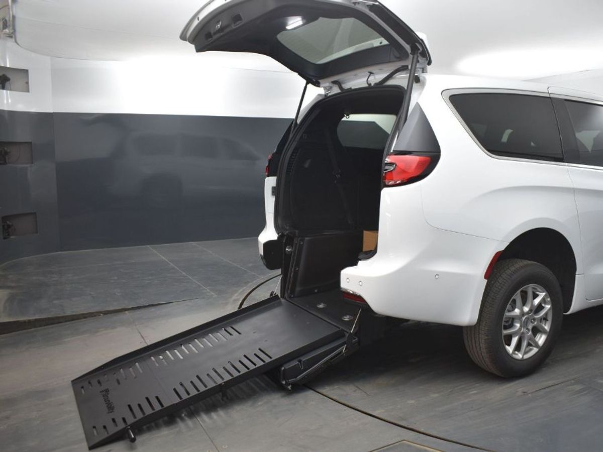 White Chrysler Pacifica with Rear Entry Manual Fold Out ramp