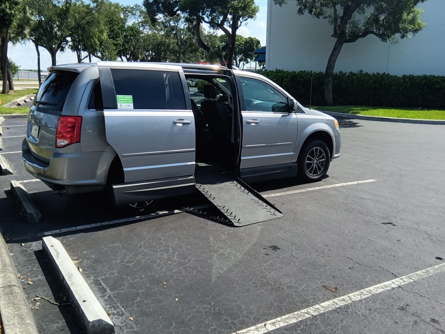 Silver Dodge Grand Caravan with Side Entry Automatic Fold Out ramp