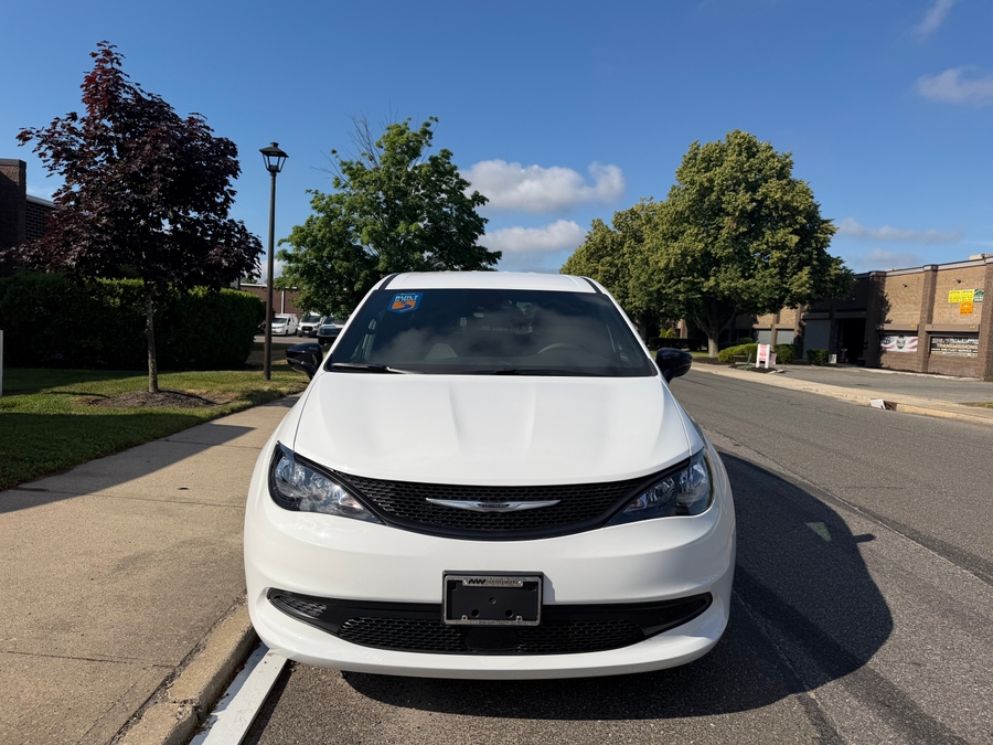White Chrysler Voyager with Rear Entry Manual Fold Out ramp