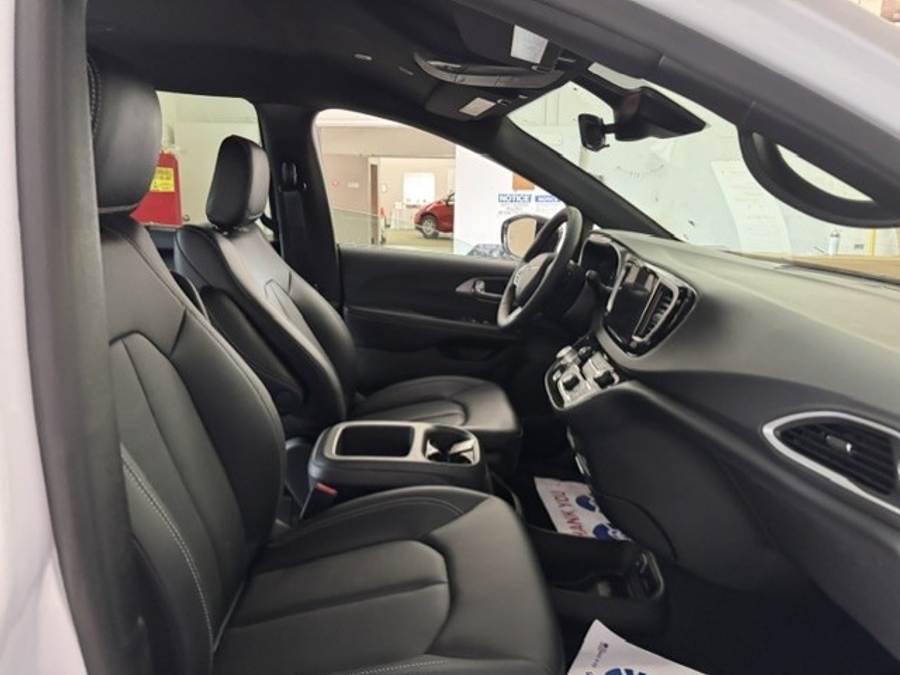 White Chrysler Voyager with Rear Entry Manual Fold Out ramp