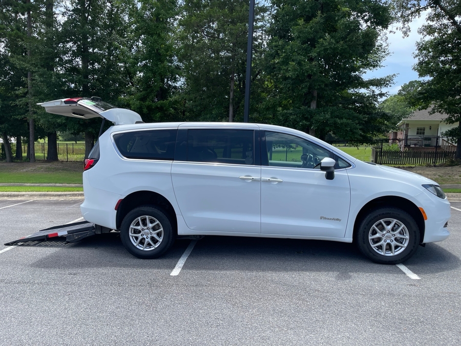 White Chrysler Voyager with Rear Entry Manual Fold Out ramp