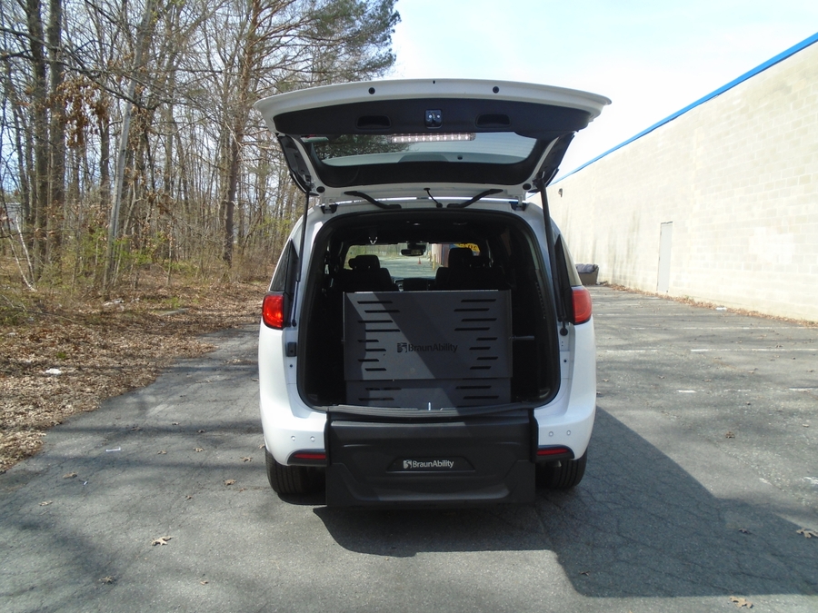 White Chrysler Voyager with Rear Entry Manual Fold Out ramp