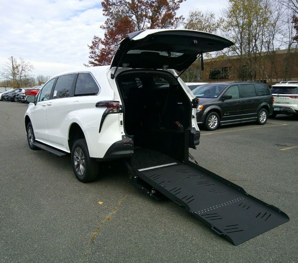 White Toyota Sienna with Rear Entry Manual Fold Out ramp