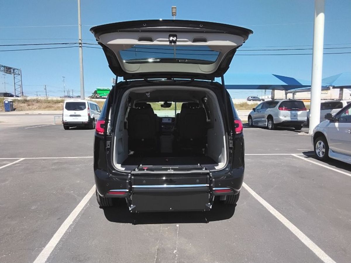 Black Chrysler Pacifica with Rear Entry Manual Fold Out ramp