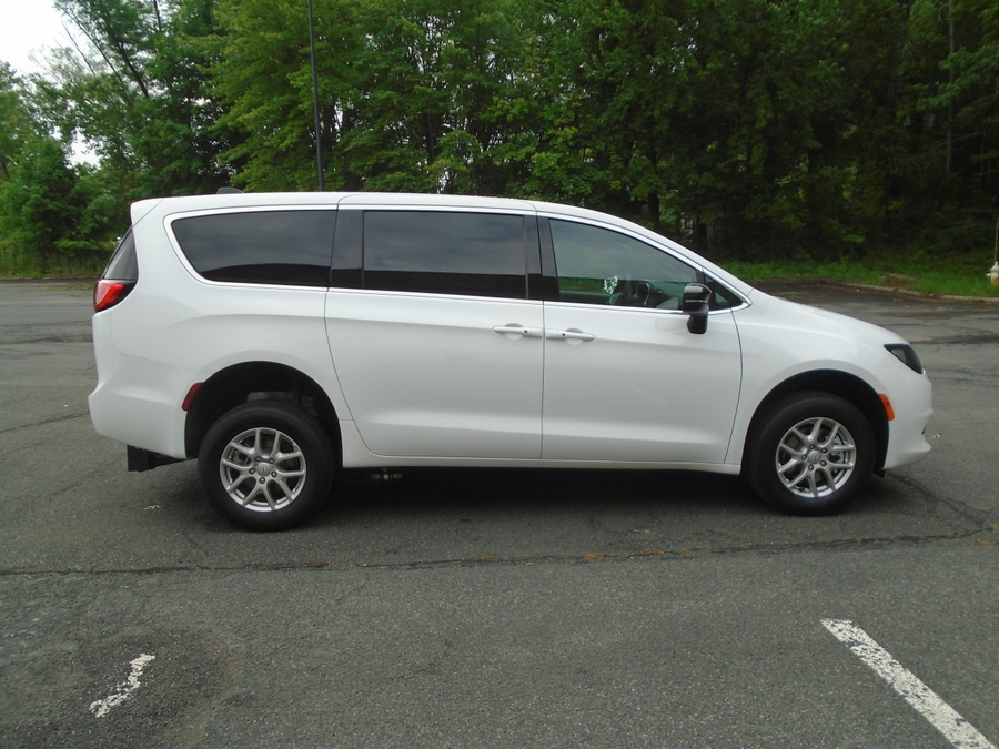 White Chrysler Voyager with Rear Entry Manual Fold Out ramp