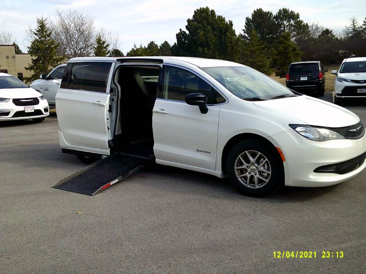 White Chrysler Voyager with Side Entry Automatic Fold Out ramp