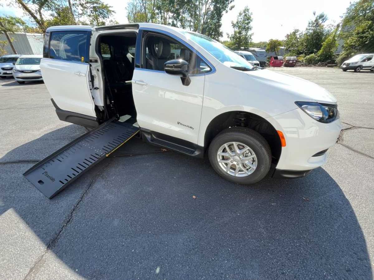 White Chrysler Voyager with Side Entry Manual Fold Out ramp
