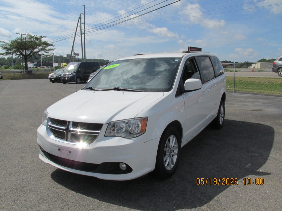 White Dodge Grand Caravan with Side Entry Automatic Fold Out ramp