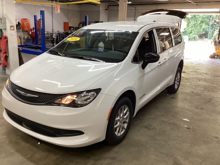 White Chrysler Voyager with Rear Entry Manual Fold Out ramp