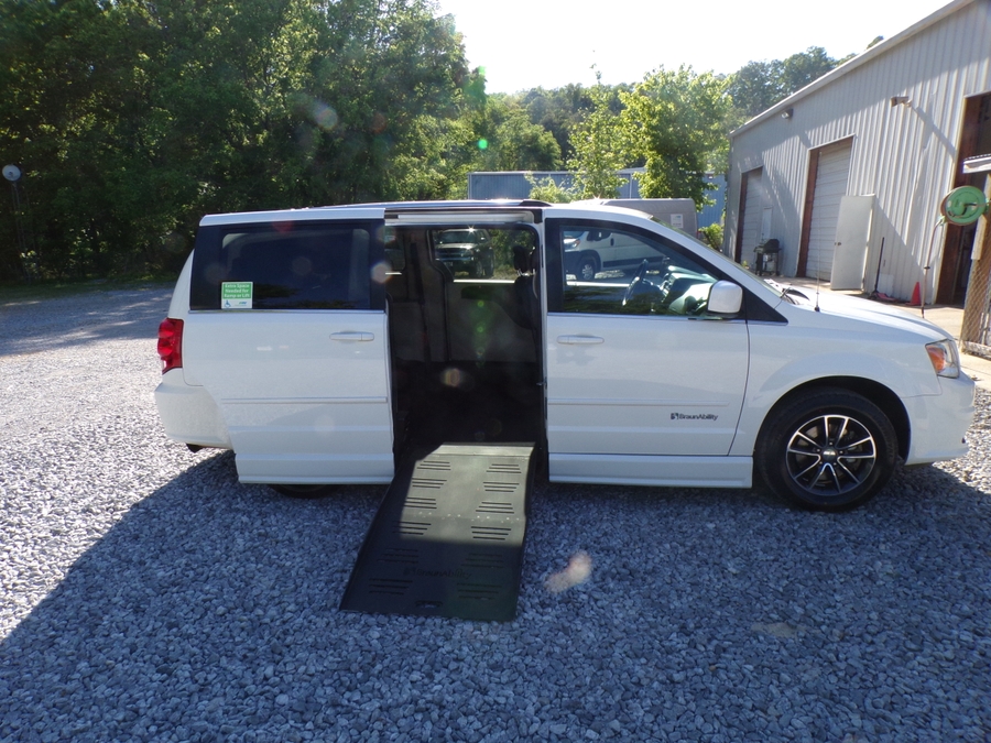 White Dodge Grand Caravan with Side Entry Manual Fold Out ramp