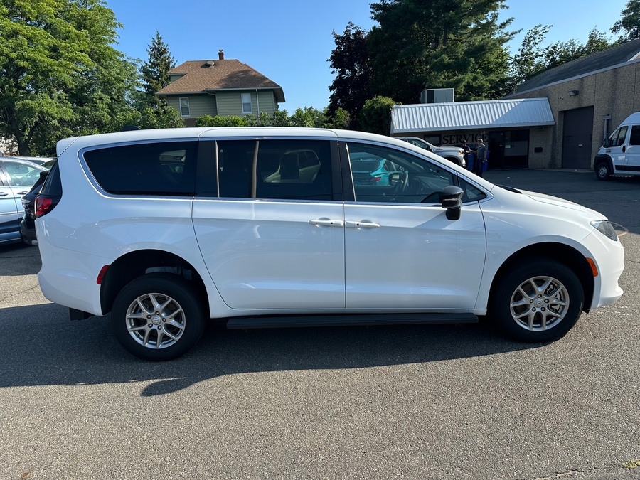 White Chrysler Voyager with Rear Entry Manual Fold Out ramp