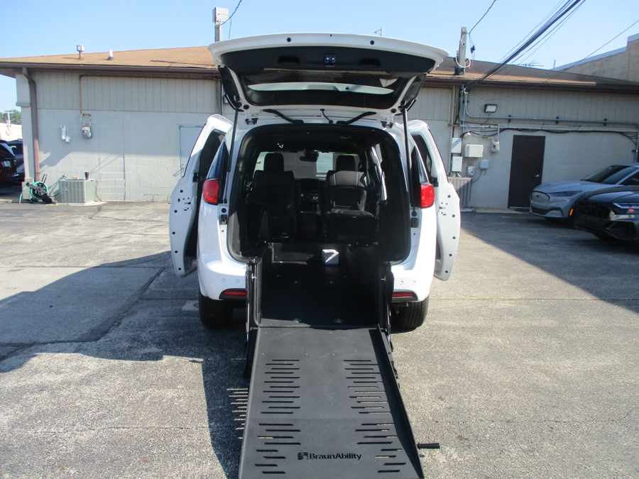 White Chrysler Voyager with Rear Entry Manual Fold Out ramp