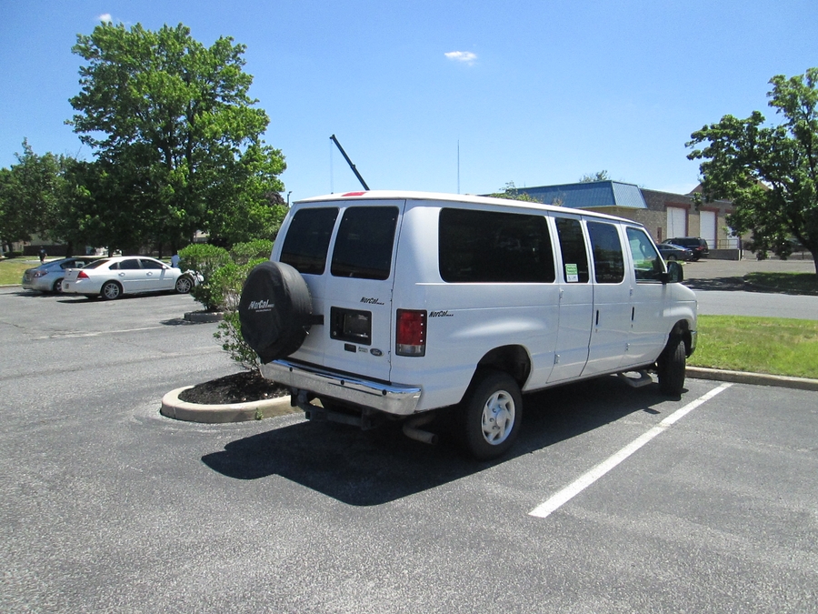 White Ford Econoline with Side Entry Automatic Fold Out ramp