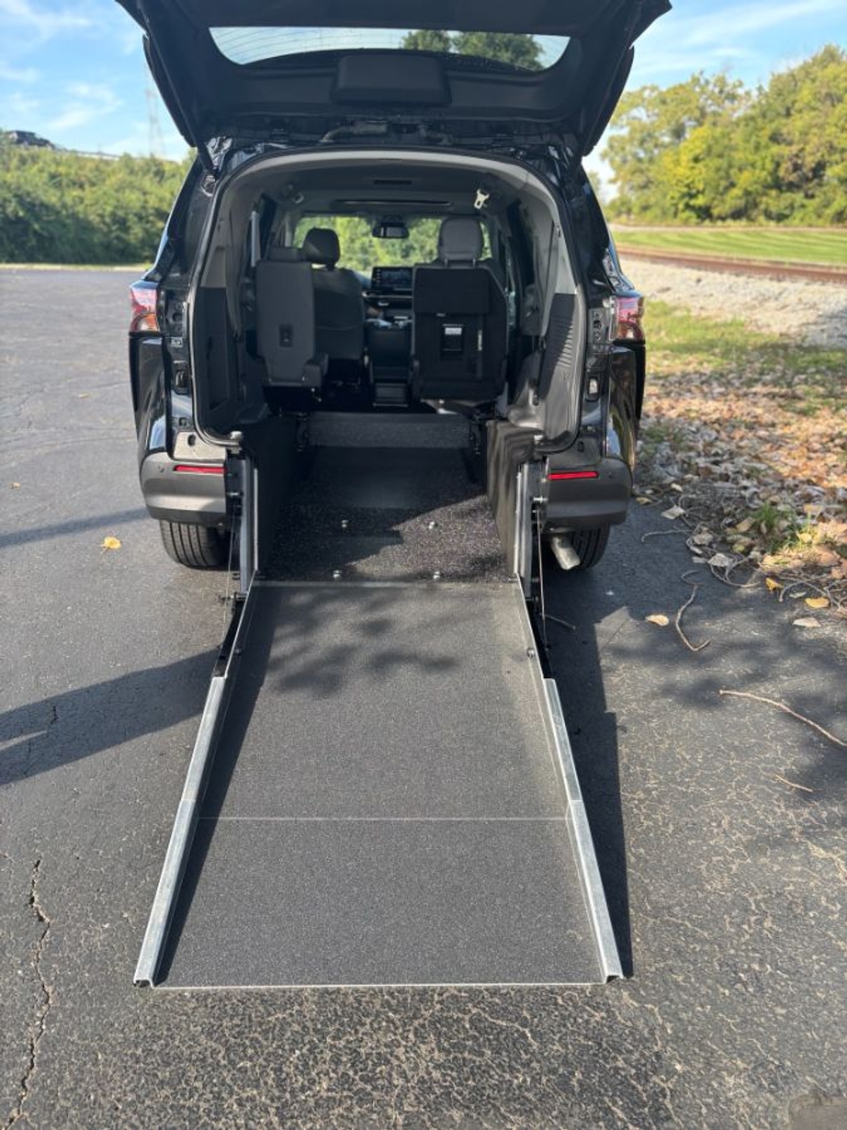 Black Toyota Sienna with Rear Entry Manual Fold Out ramp