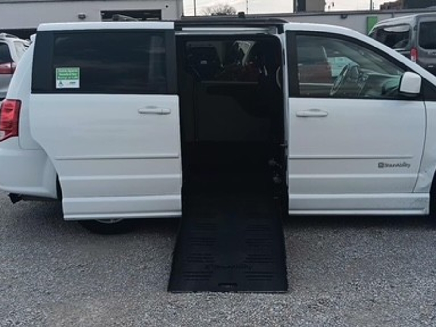 White Dodge Grand Caravan with Side Entry Manual Fold Out ramp