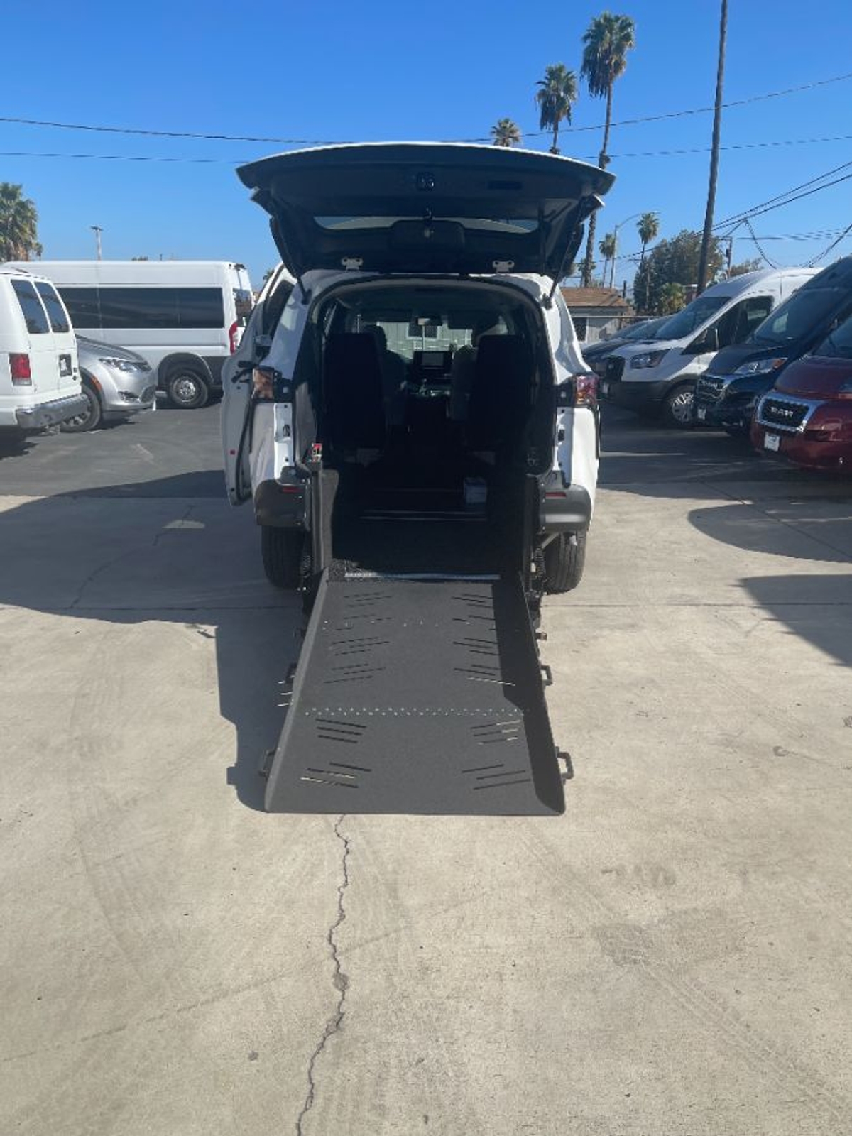White Toyota Sienna with Rear Entry Manual Fold Out ramp