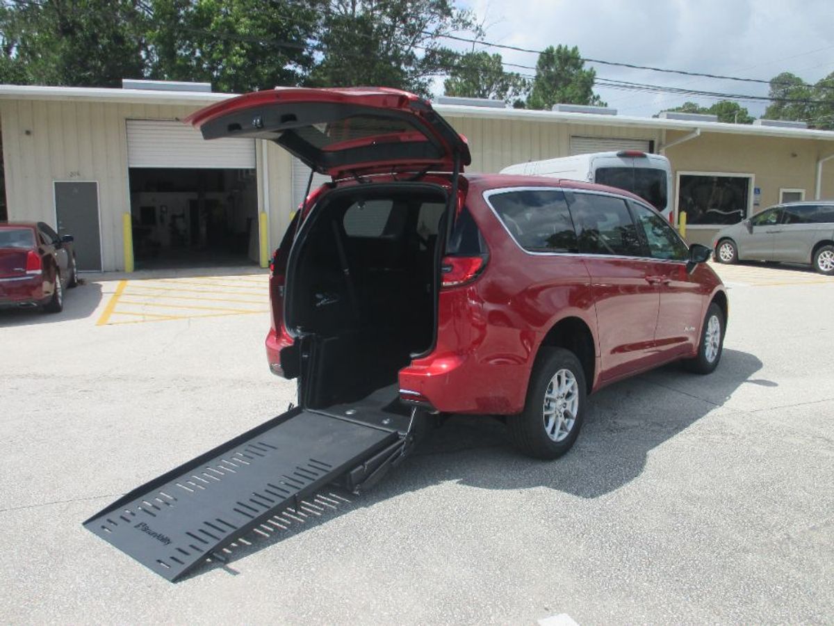 Red Chrysler Pacifica with Rear Entry Manual Fold Out ramp