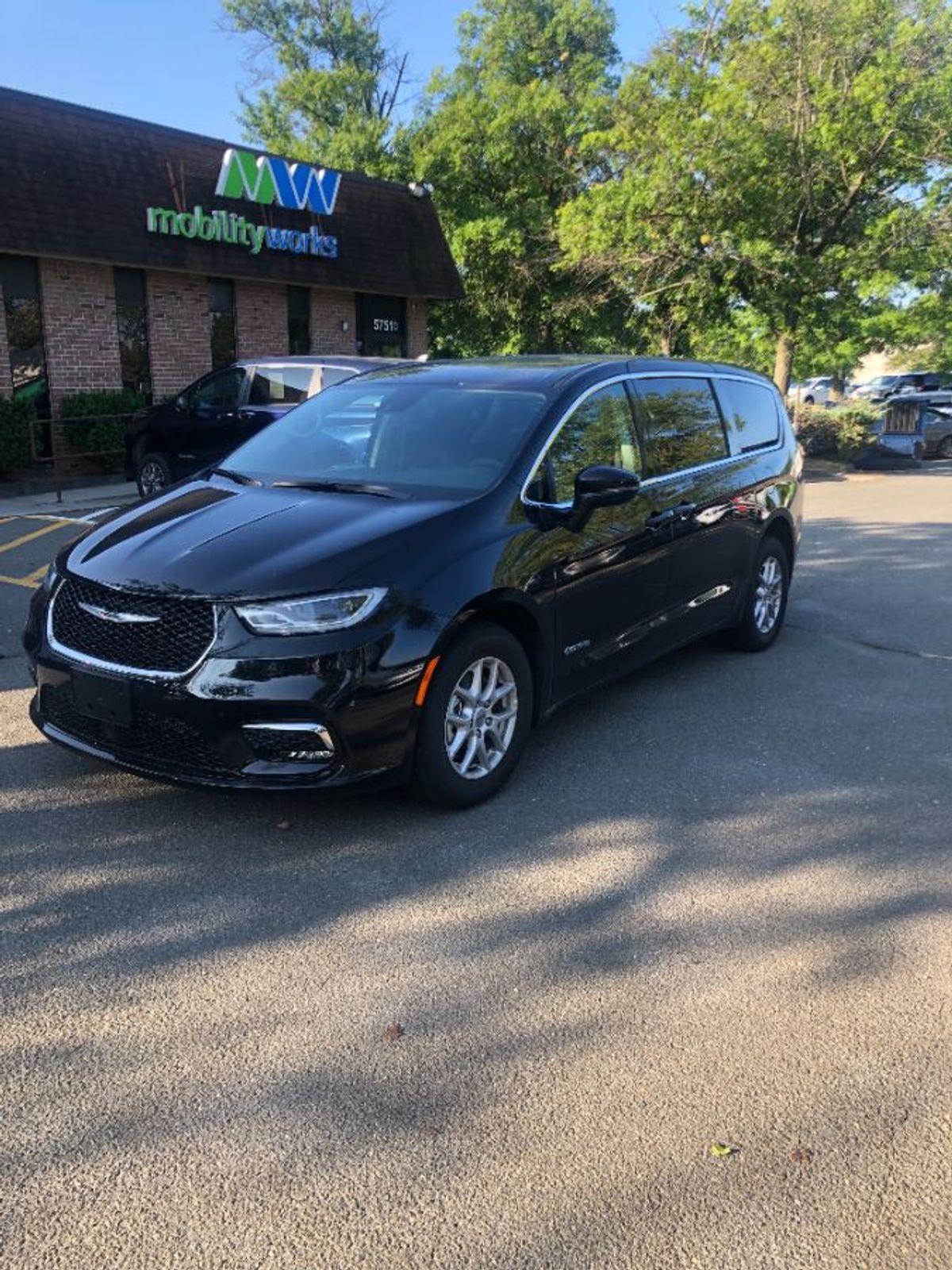 Black Chrysler Pacifica with Side Entry Automatic Fold Out ramp