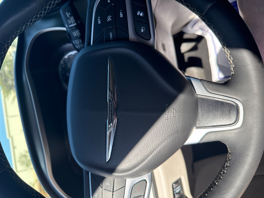 White Chrysler Pacifica with Rear Entry Manual Fold Out ramp