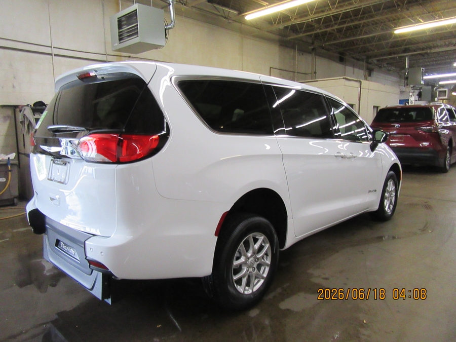 White Chrysler Voyager with Rear Entry Manual Fold Out ramp