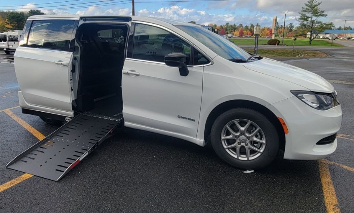 White Chrysler Voyager with Side Entry Automatic Fold Out ramp
